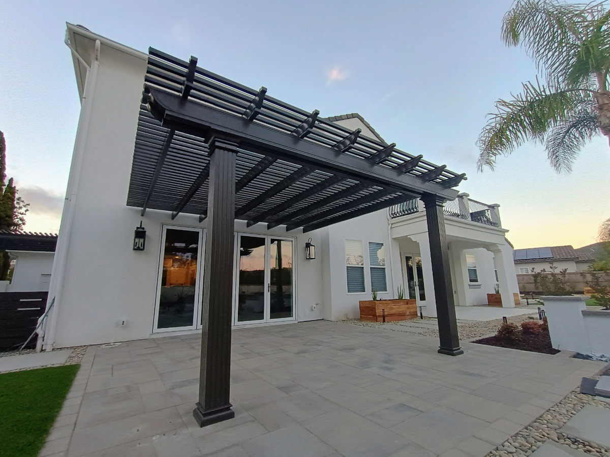 Aluminum patio cover with attached posts and clean modern fascia detailing